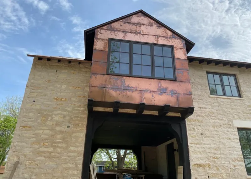 Copper metal panel facade on a stone building for Metal Roof Coating in Rock Springs