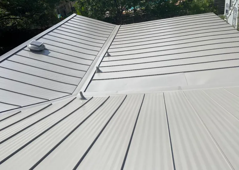 Solar attic fan installed on a metal roof for Roof Ventilation in Rock Springs